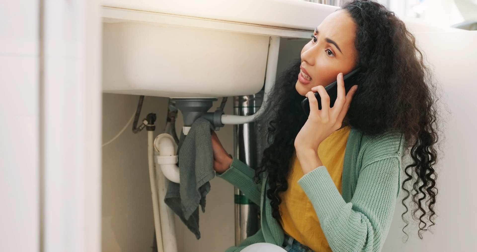 Homeowner calling Doherty's Plumbing about a sink leak